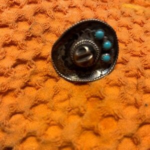 Source Unknown Silver and Turquoise “cowboy hat” ring. Very cute.
